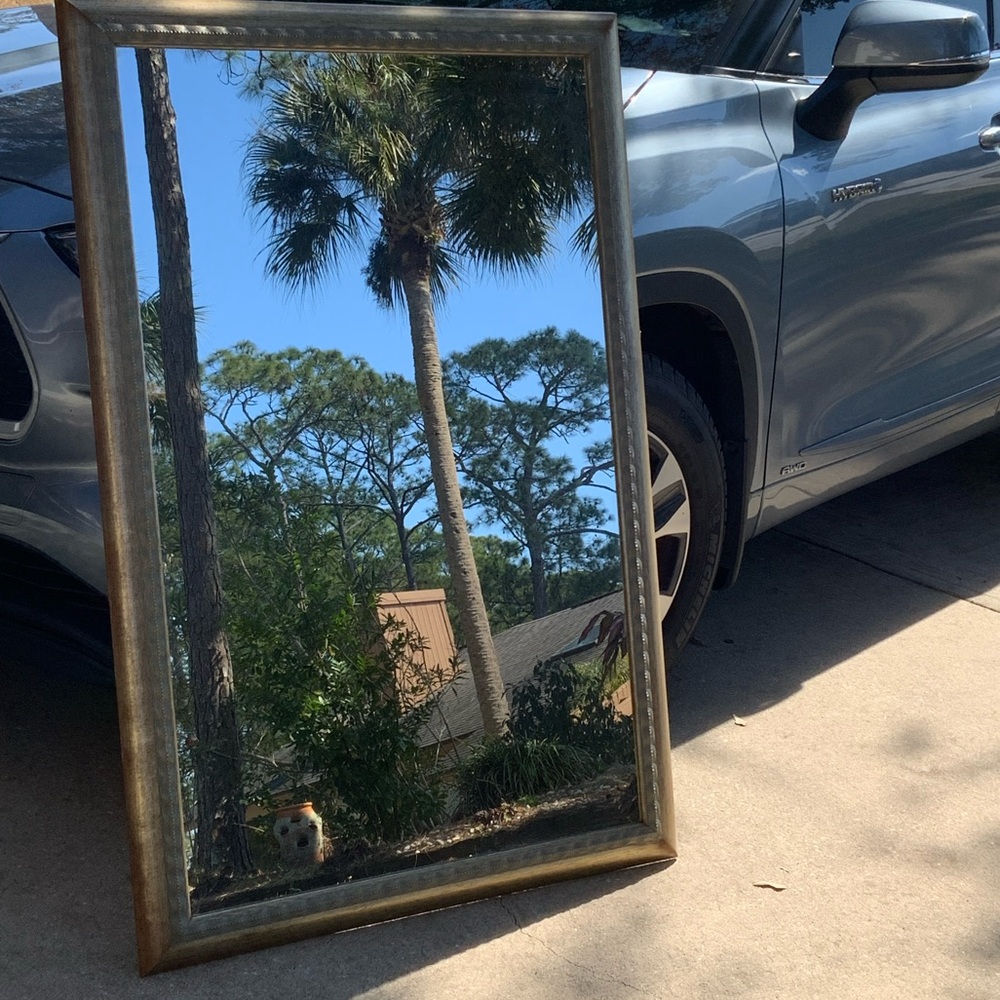 Beautiful mirror - frame is 35 X 54 .    Frame has gold tinge to it.